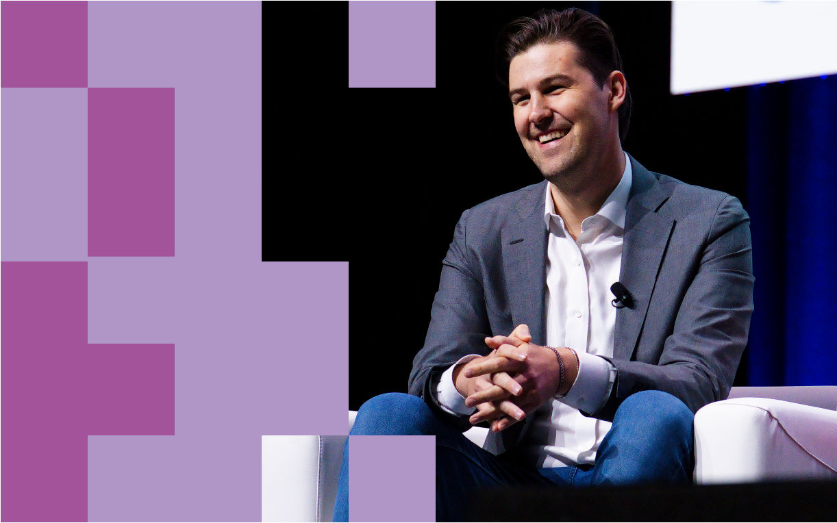 Speaker smiling on stage at GS1 Connect