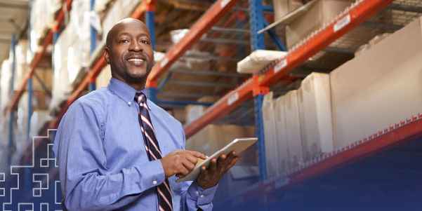 siness person in warehouse taking inventory