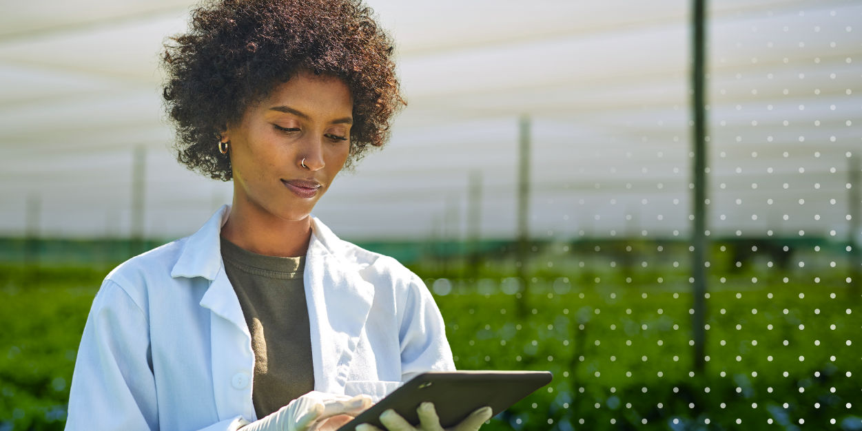 Farmer with tablet gathering data