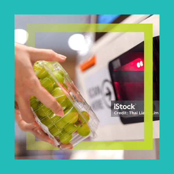 Person scanning product at checkout