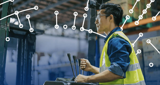 Warehouse worker standing in front of equipment and Share Product Data