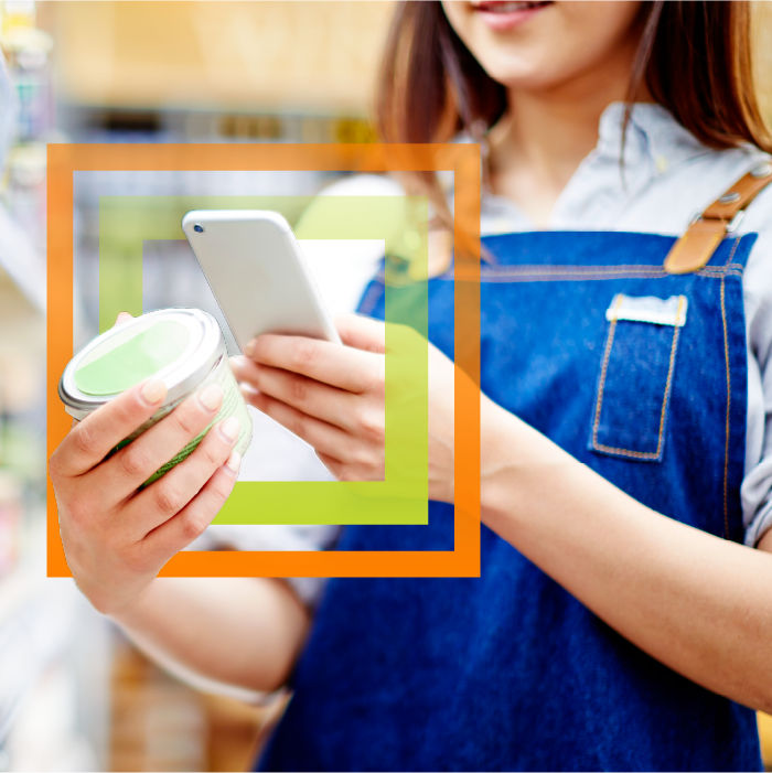 Woman scanning product with her phone