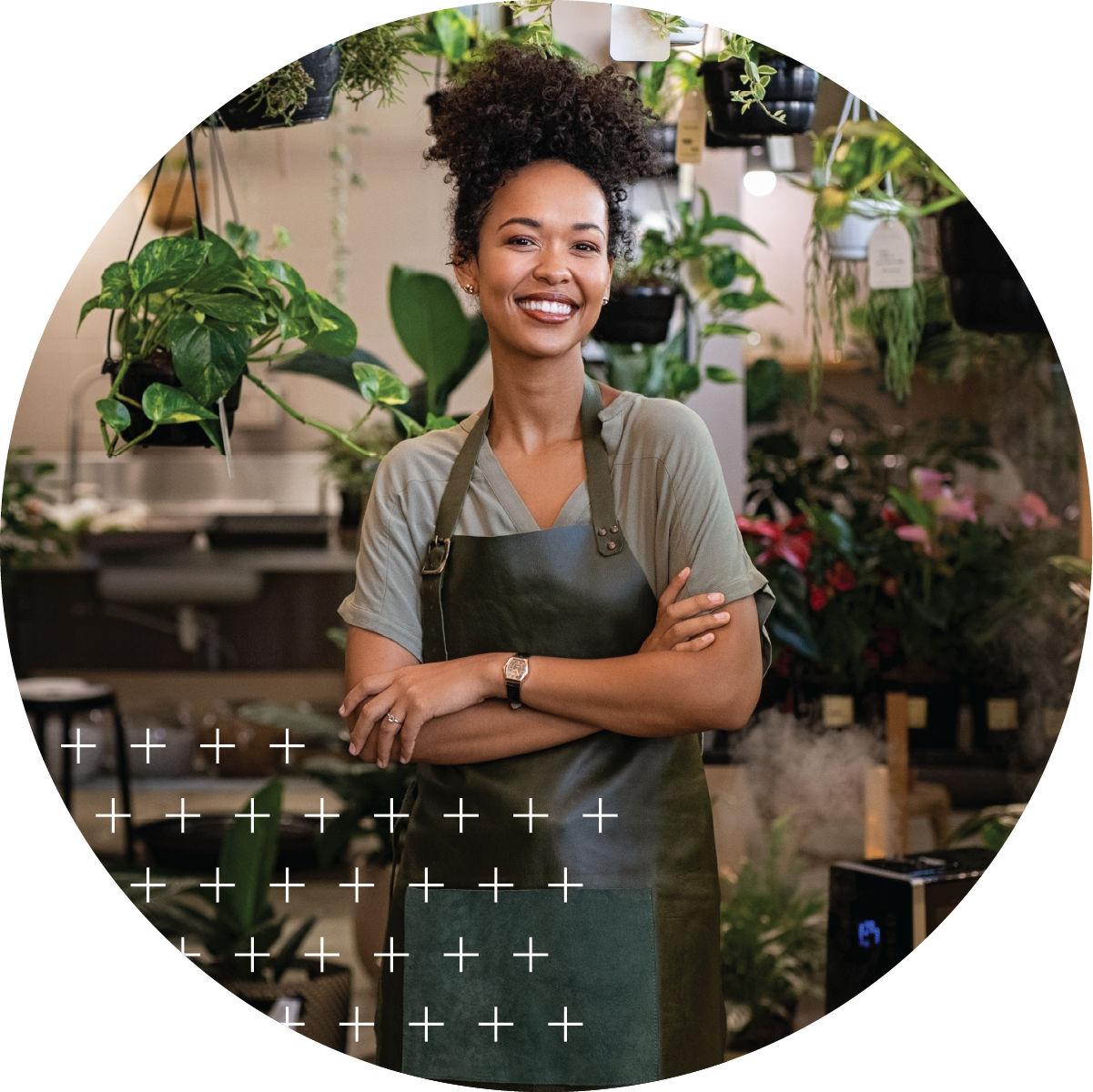 Small business owner smiling in plant nursery 