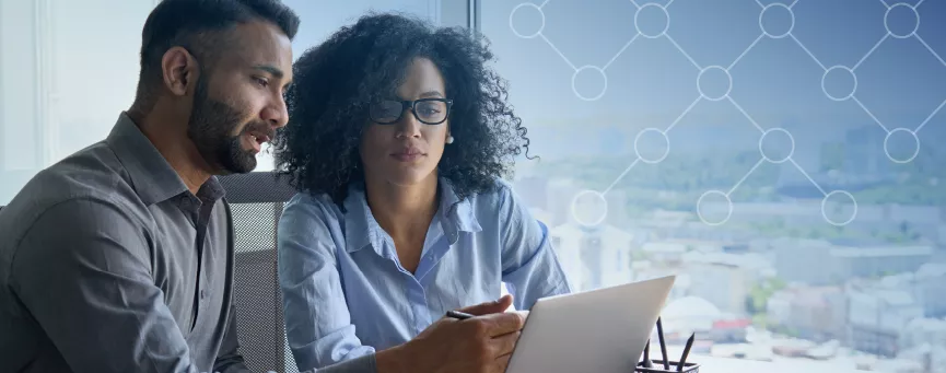 Two people working together on a computer