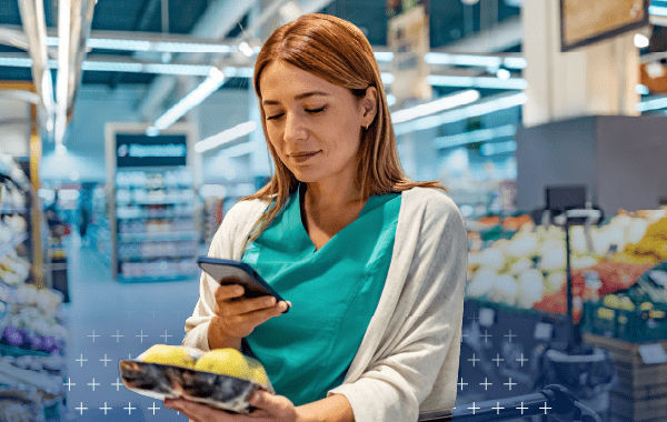 Woman scanning fruit at store