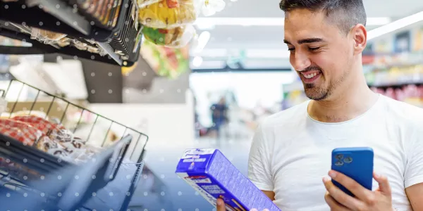 Consumer shopping, holding product and their phone to scan 2D data carrier
