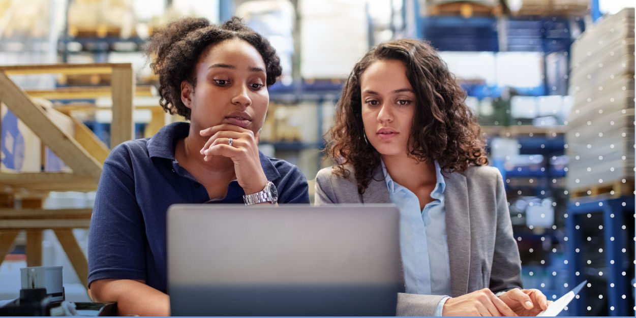 Warehouse managers on laptop