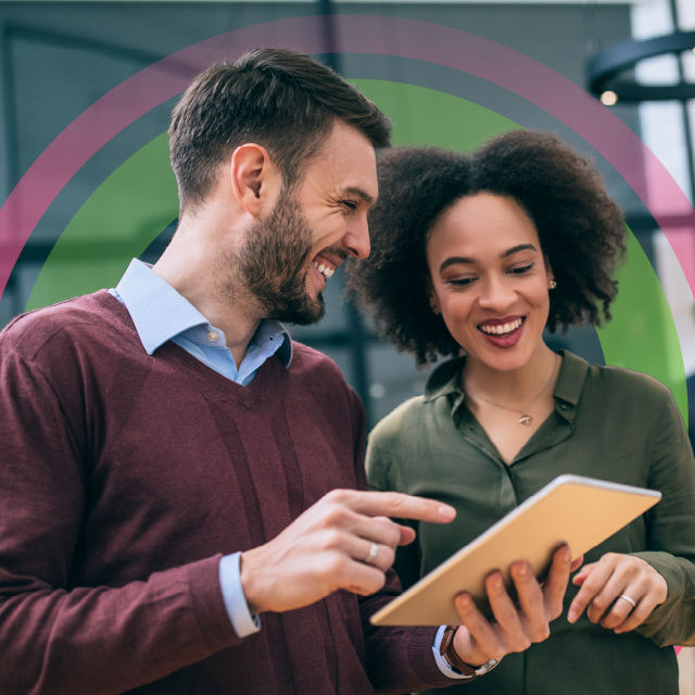 two business people reviewing information on a tablet