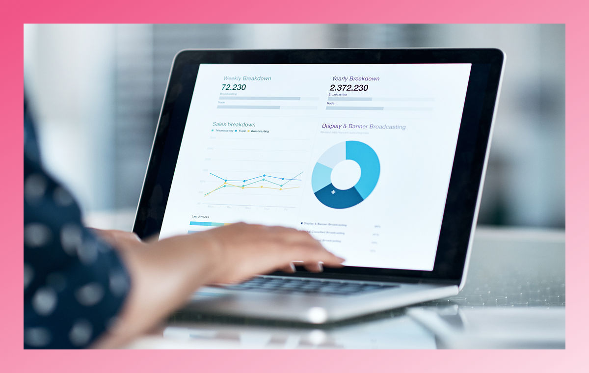 person reviewing data charts on laptop