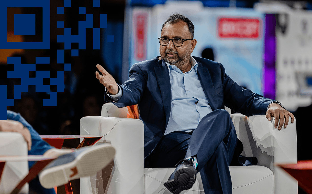 Conference speaker sitting on stage during panel