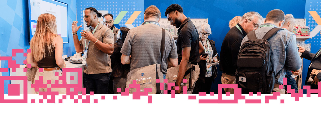 Conference attendees engaging with an exhibit on advanced data carriers