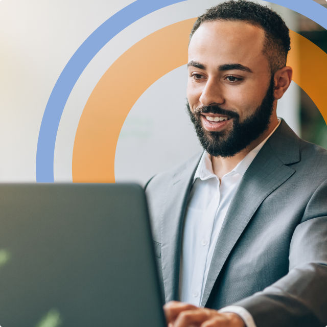 Image of a business man using a laptop