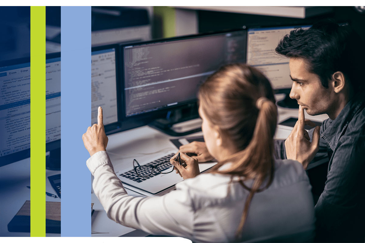 Developers looking at a computer