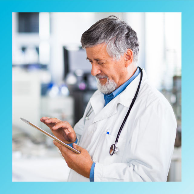 Physician reviewing data on a tablet