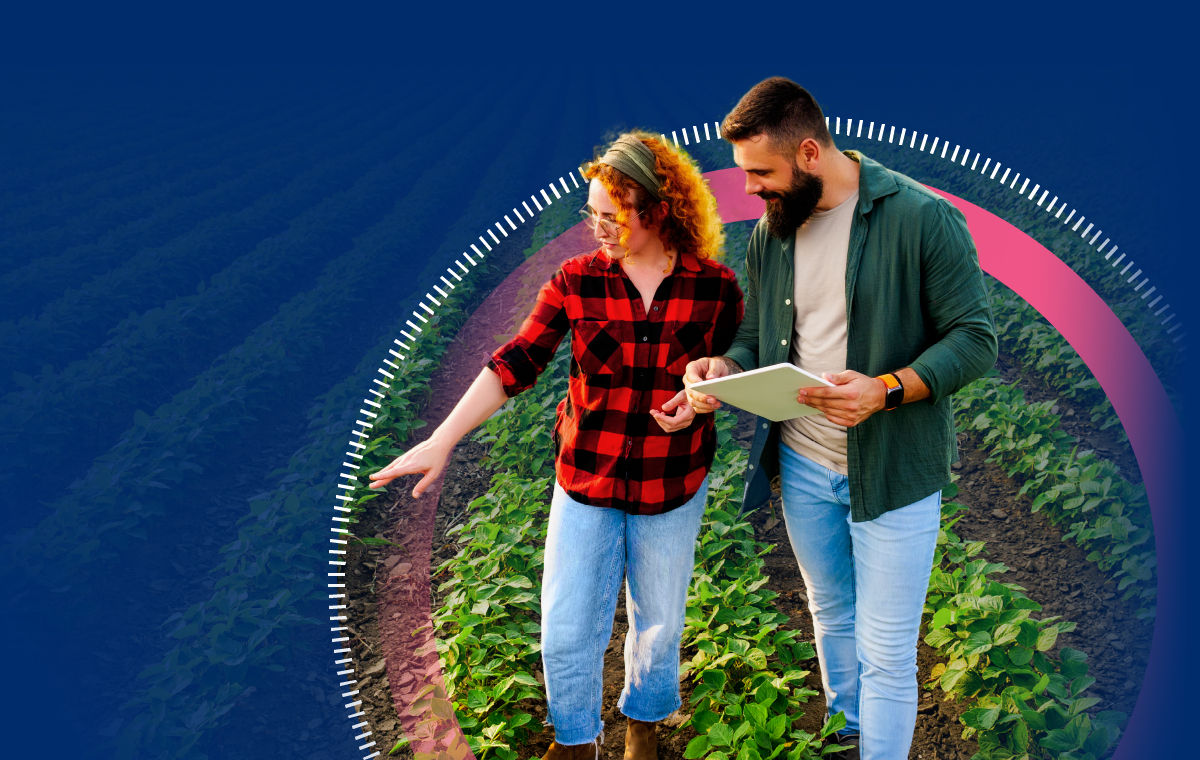 farmers walking through farm with tablet