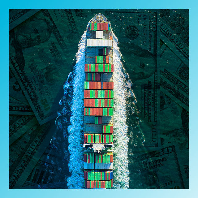 photo of cargo ship on water with money reflecting through the water