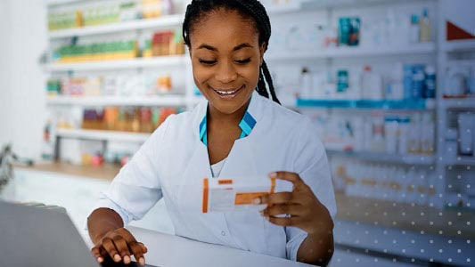 pharmacist reading prescription